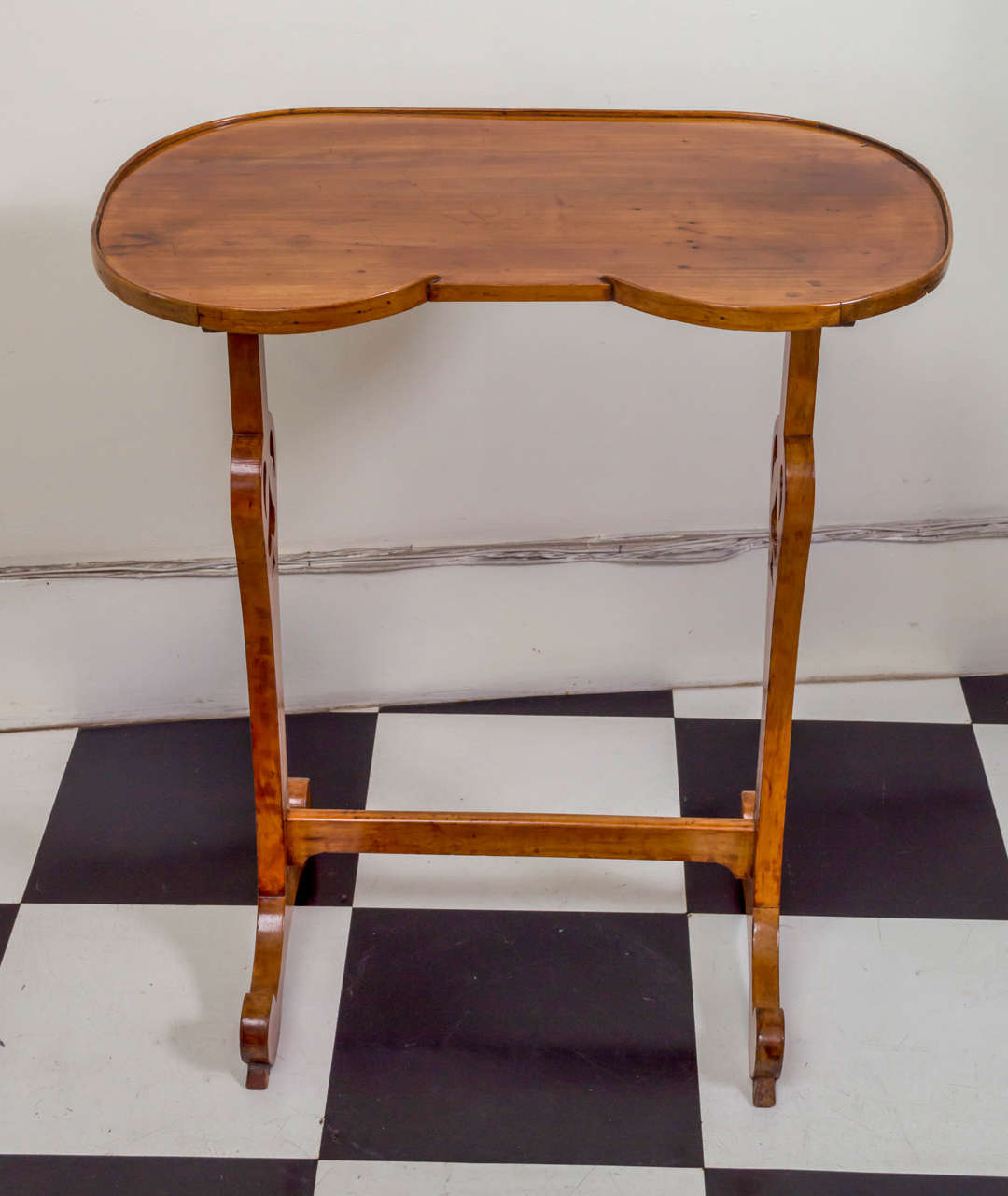 19th century French kidney form cherrywood side table. Interesting spade pierced legs and good color. Broken galleried top. French polished. Stabile footing and balance.