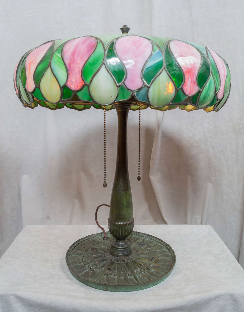 This is quite an unusual example of our favorite example of lamps, leaded glass. Most people do not realize that Tiffany was not the only maker of these lamps. We know for sure that this lamp was designed and executed by the ''Suess Co., Chicago IL.