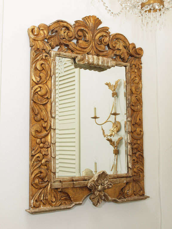 Gorgeous architectural Italian, hand carved mirror with beveled glass.  Gorgeous carvings and gilded wood.  Beautiful patina consistent with age.