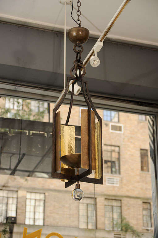Contemporary bronze lantern with a hanging crystal ball by Hervé van der Straeten.

Monogrammed: HV

Bulb: T-3 Halogen bulb
Wattage: From 75 to 350 (maximum).