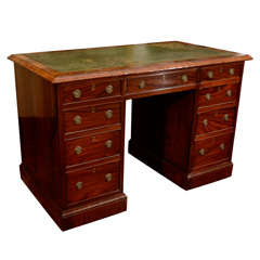 A Victorian Rosewood and Mahogany Pedestal Desk