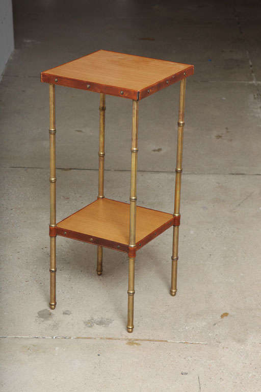 1950's night stand or side table in stitched leather with false bambou legs
