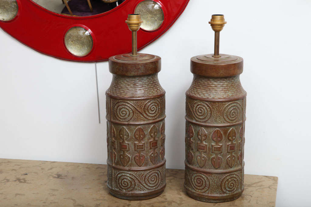 Pair of patinated solid bronze lamps.

Attributed to Calderi.