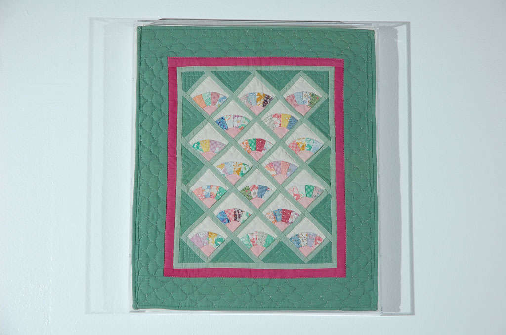 Fantastic mini fans doll quilt on a stretcher frame and mounted on a plexy box. This very finely quilted and pieced doll quilt is a real rarity. This is from a private collection out of Ohio. Such great graphics and beauty.
 
