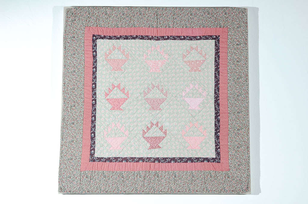 This finely pieced small crib quilt has such great Calico fabrics of great pastel colors. The condition is very good and is hand-sewn on linen and on a stretcher frame. This little beauty is from a private collection and is originally from Ohio.
 