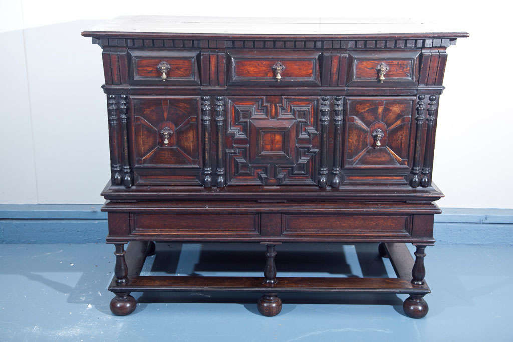 This two drawer oak chest on stand from Germany features the geometric panels common in furniture in Germany, England and the Netherlands during the mid to late 17th century, except here it is taken to a whole new level with the degree of intricacy