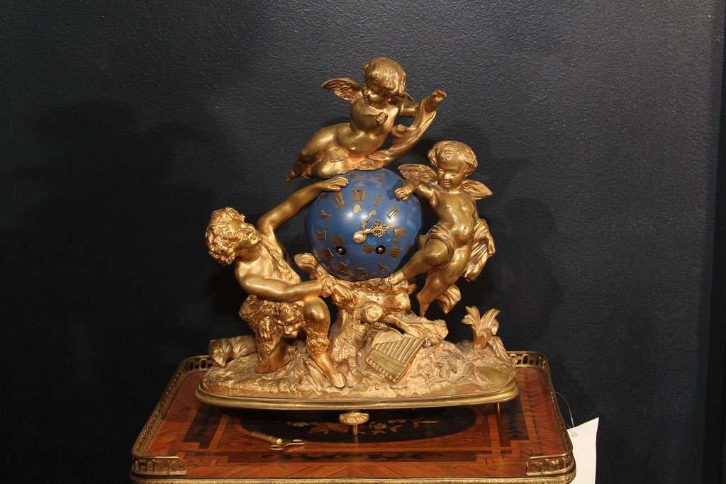 Gilt Louis XV style mantel clock. Satyr and cherub motif. Clock has just been serviced. Clock stamped VINCENTI & CIE. MEDAILLE D'ARGENT 1856.

OFFERED AT THIS 50% OFF PRICE FOR  2015 ONLY!