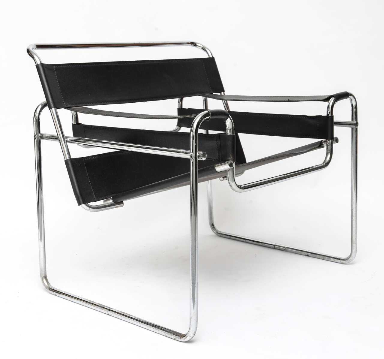 A classic pair of Wassily armchairs by Marcel Breuer in chrome and black leather.