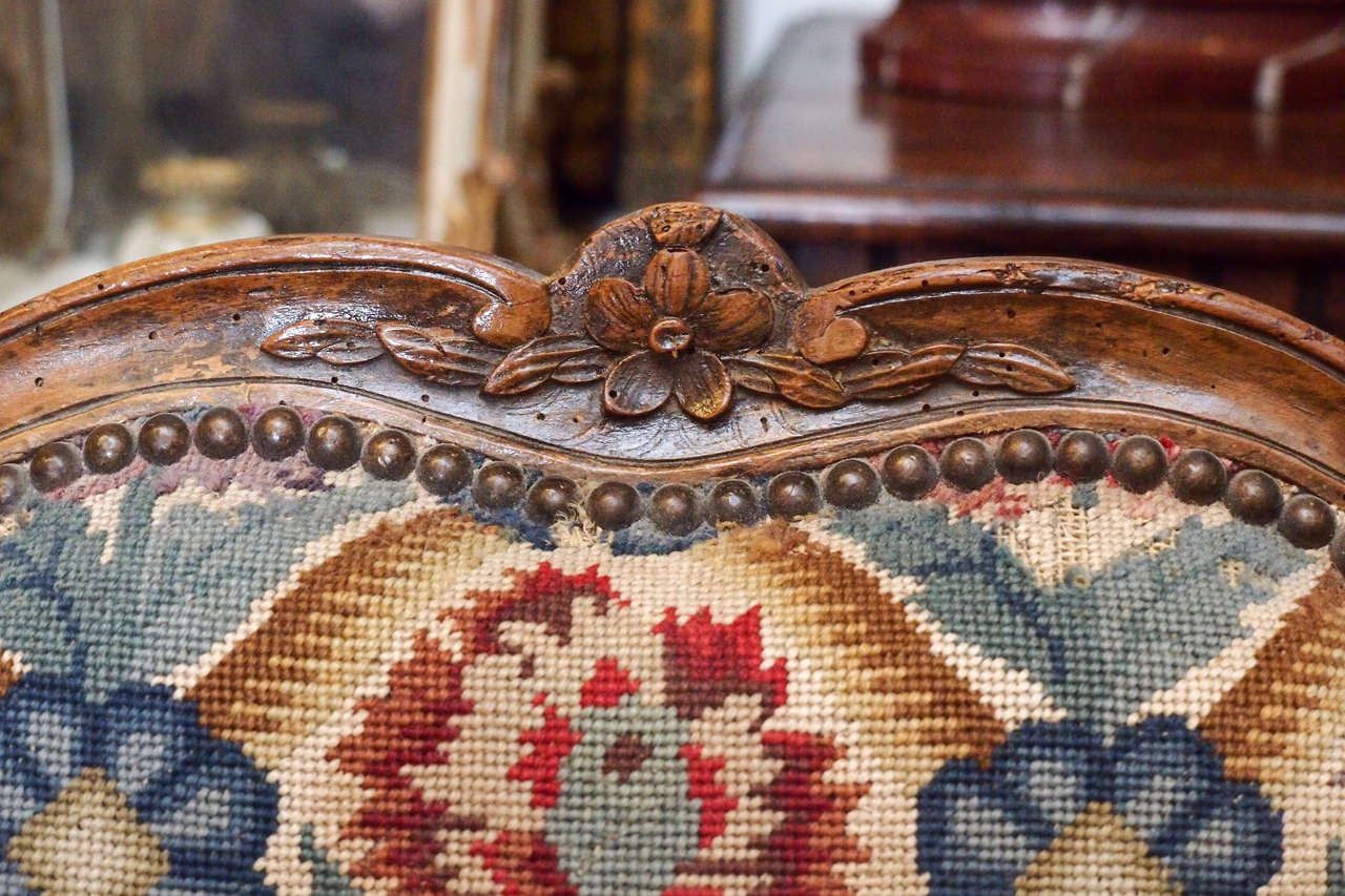 Pair of Period Louis XV Walnut Bergere with Needlepoint Upholstery In Excellent Condition In Natchez, MS
