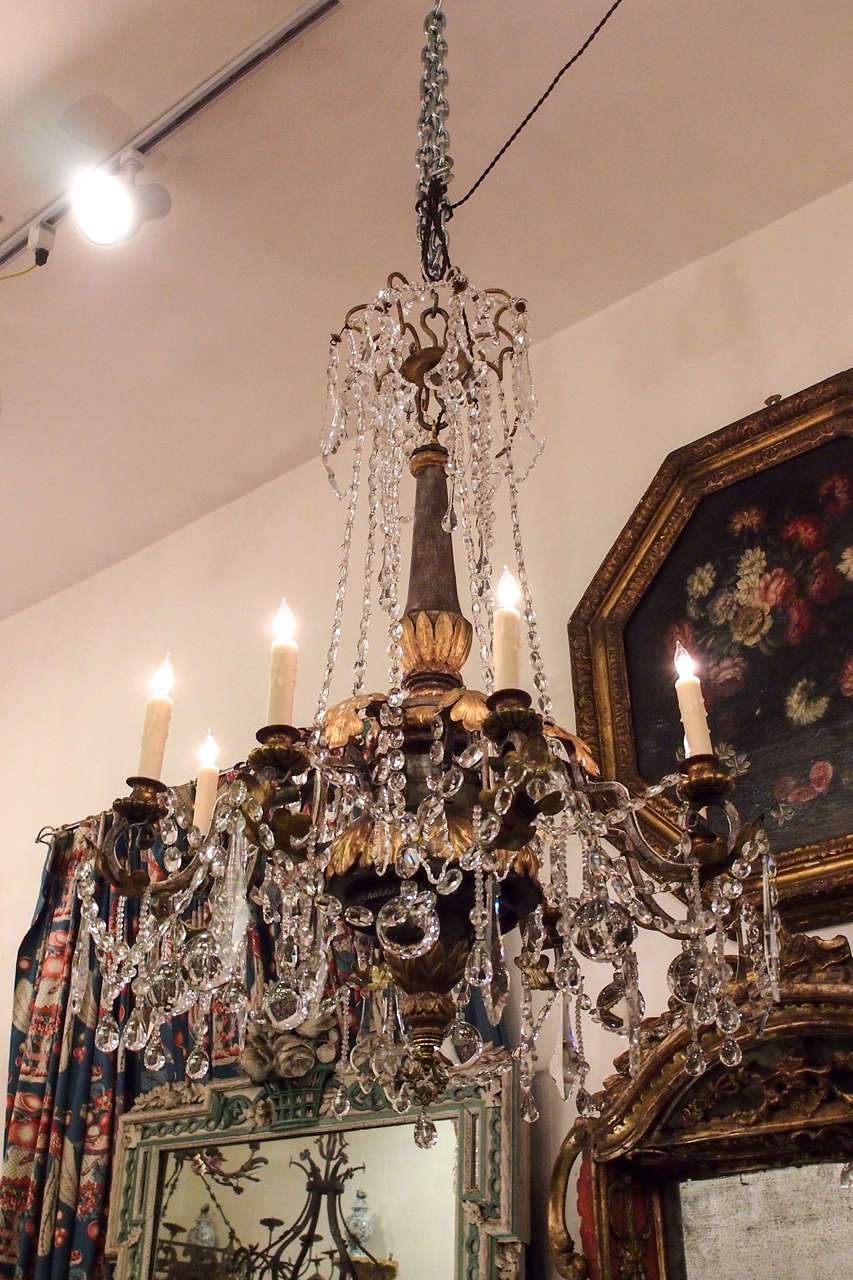 Italian Gilt Wood , Gilt Iron and Crystal Two Tiered Chandelier Of unusual form.