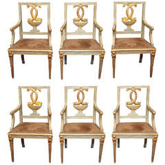 Set of Six Paint and Parcel Gilt Armchairs with Dolphin Motif