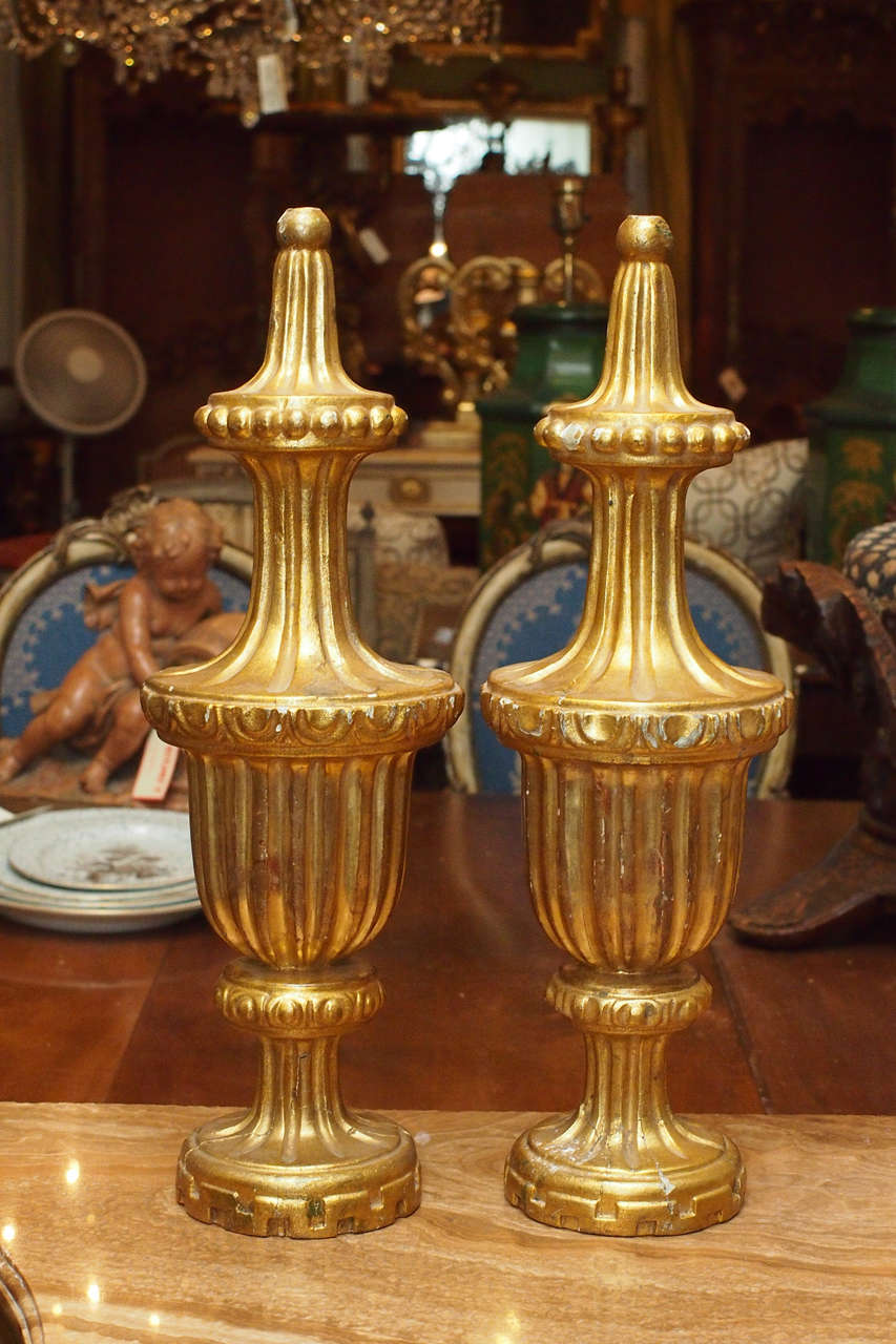 Pair of Gilt wood finials with beading and fluting