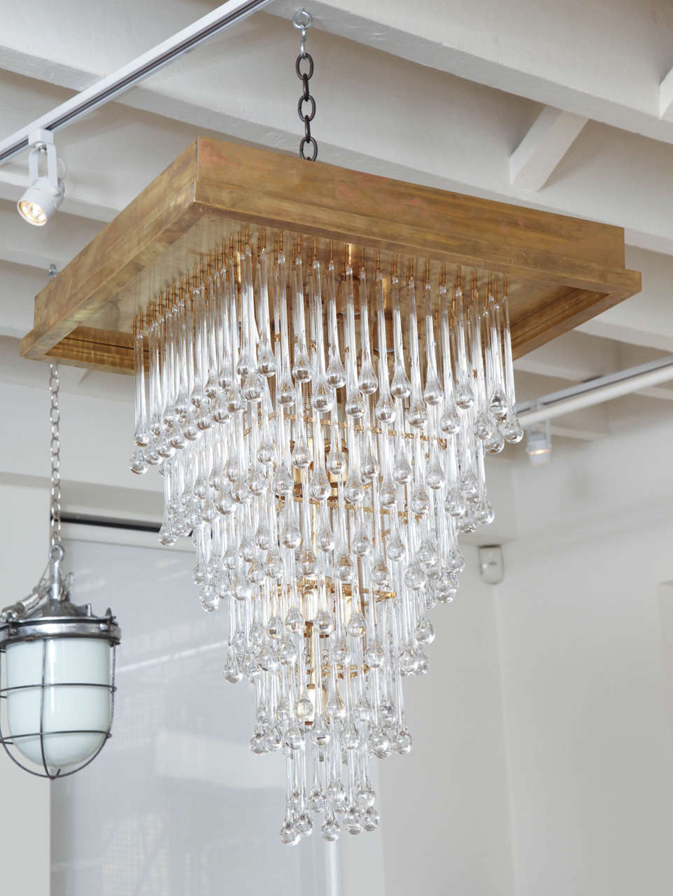 Large tiered tear-drop crystal chandelier with brass mount, from Canary Island Hotel.