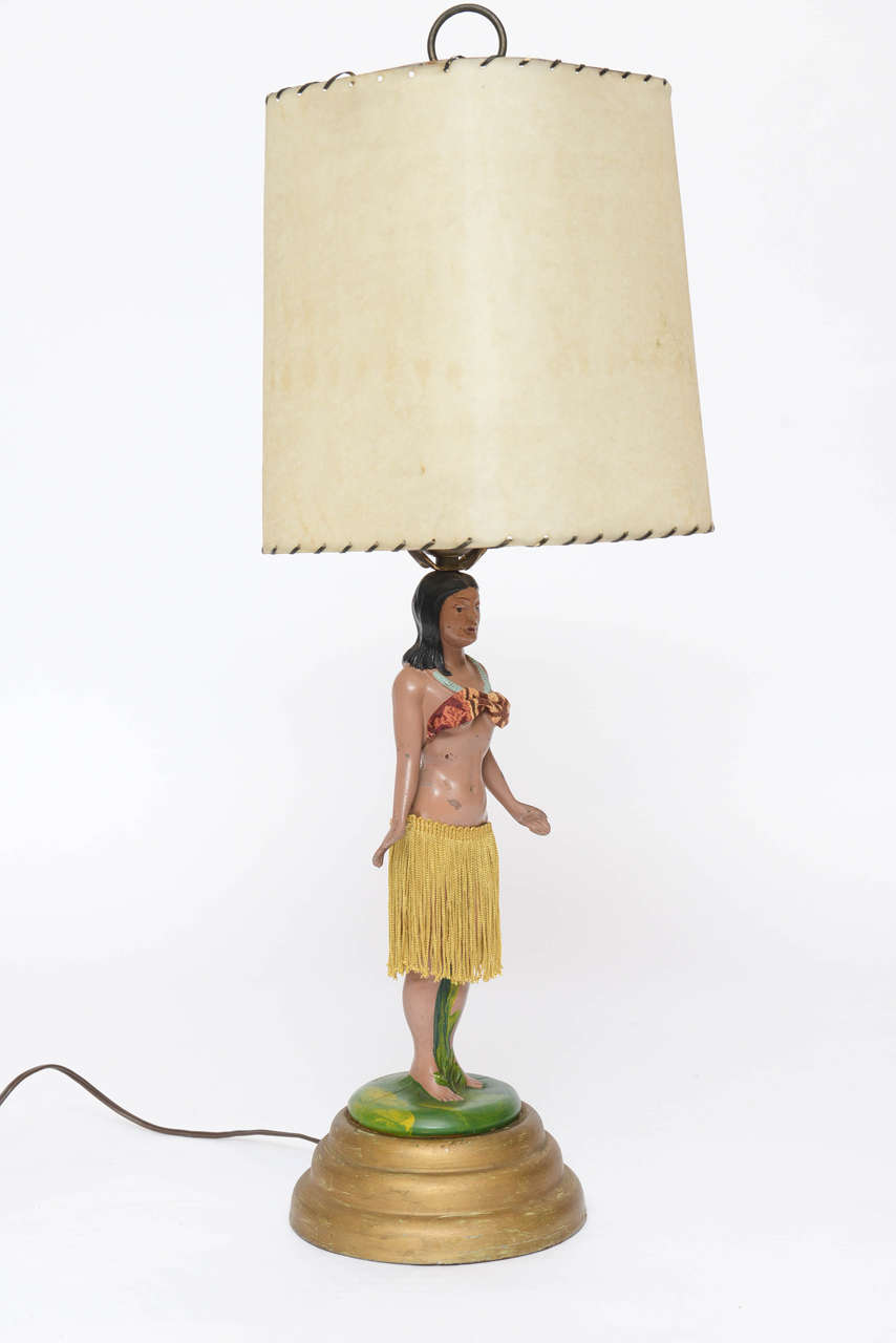 This is a motion Hula Girl lamp, her hips sway and is FULLY functioning.  ALL ORIGINAL hula skirt and top, this was purchased in Hawaii.  Original shade as well.