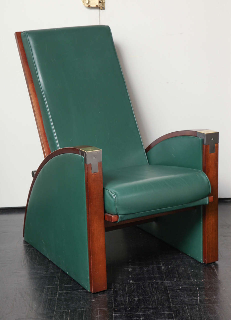 Mid-20th century mahogany and leather armchair, angular back, exaggerated curved arms ending in square straight legs.