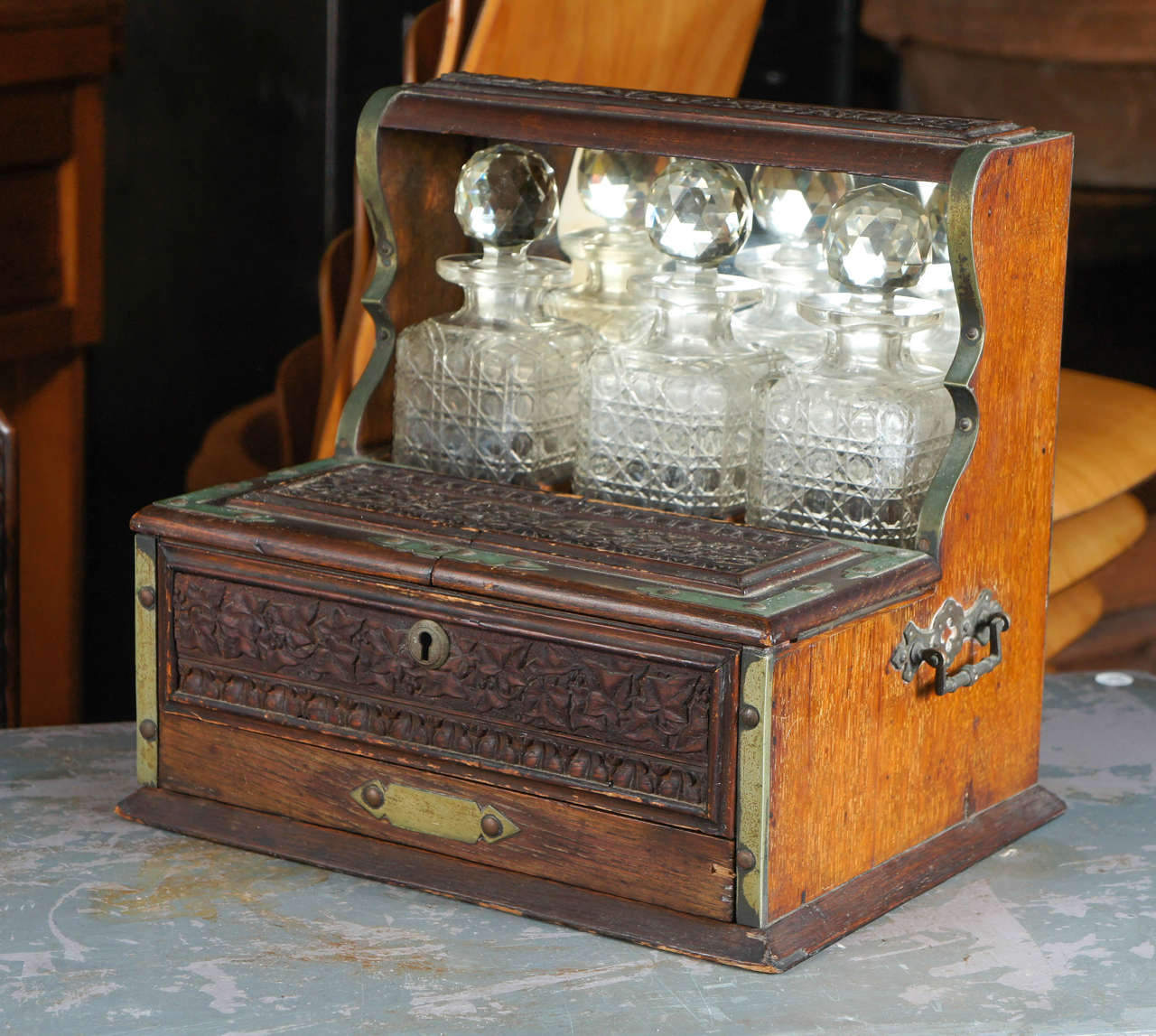 Tantalus, oak and brass with crystal bottles