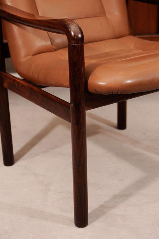 Pair of rosewood and leather armchairs, signed. Marked with original paper labels.

Reduced From: $2,500