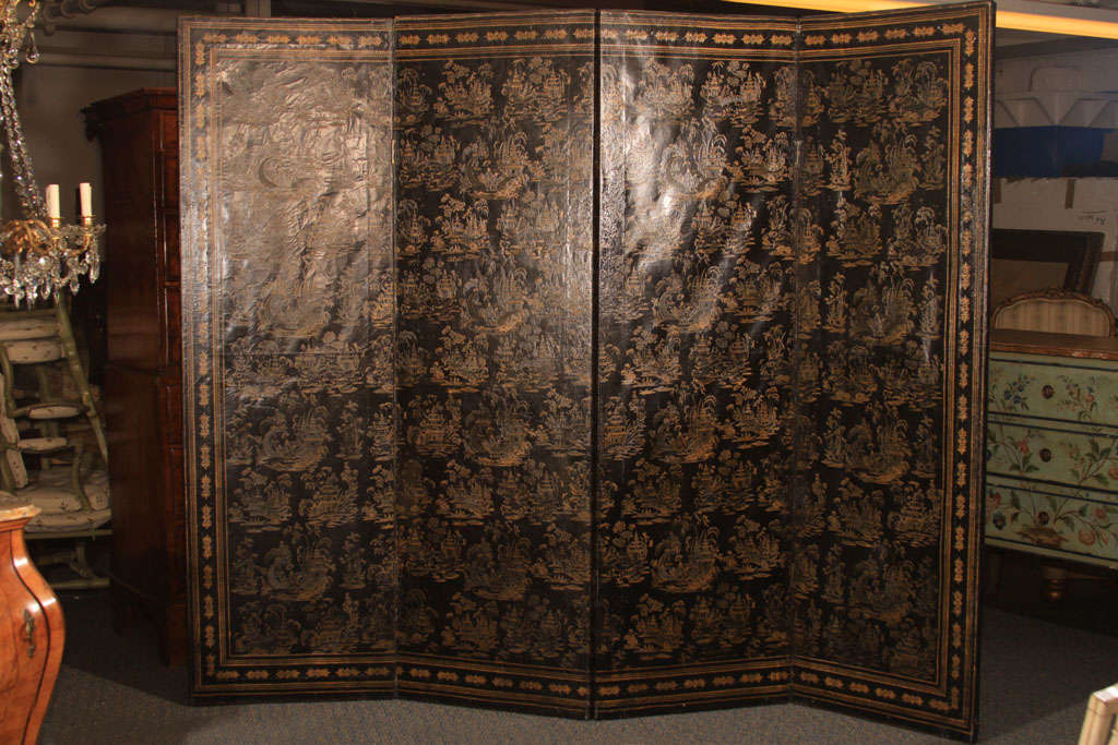 A fine 18th century Chinese <br />
export black leathr screen with embossed and raised gilt decoration