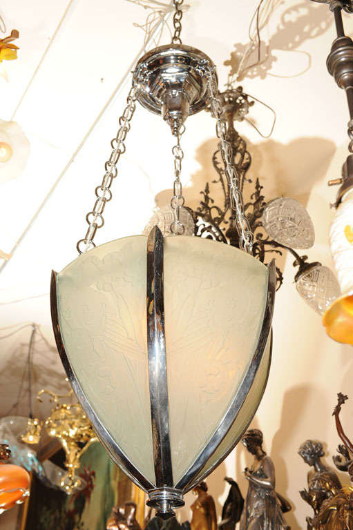 This very high quality, large pendant is etched with floral designs and encased in rich chrome metal work. A very impressive piece of lighting.