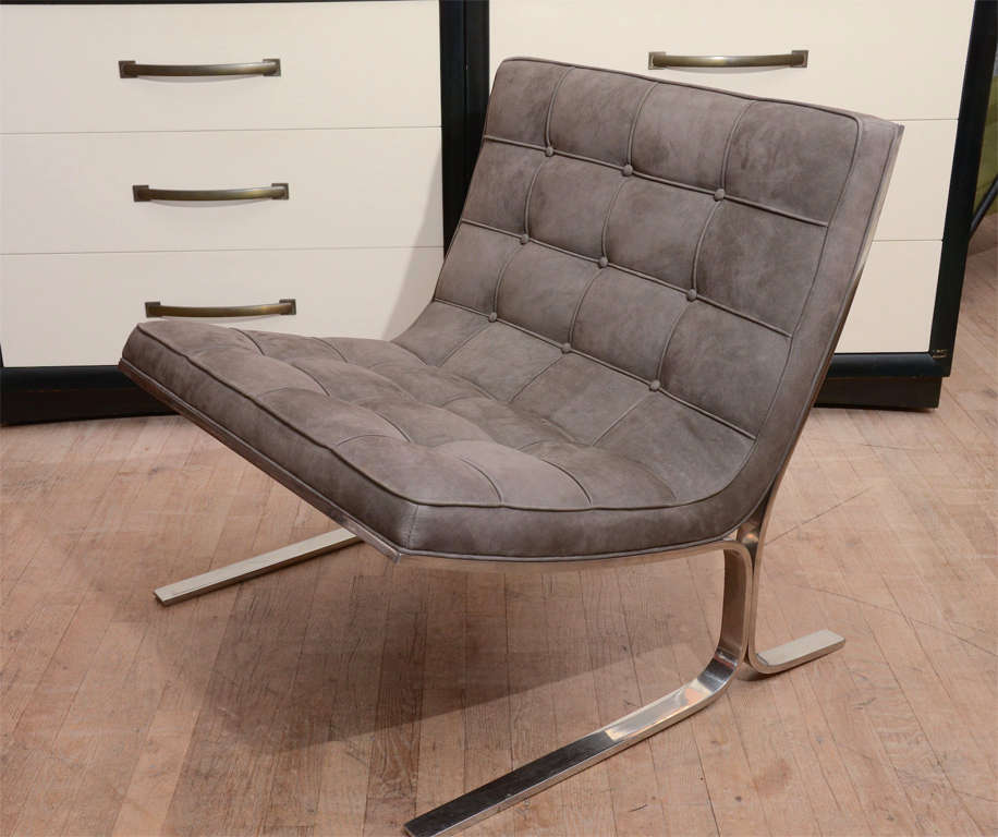 A Nicos Zographos occasional chair re-upholstered in elephant grey  suede, with chrome legs.