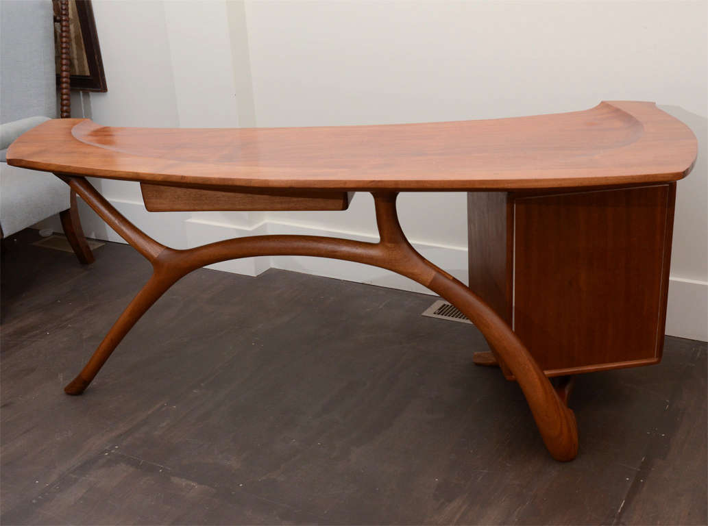 Vintage wooden desk with unique lines + organic shape. Desk has pencil drawer + two additional storage drawers. 