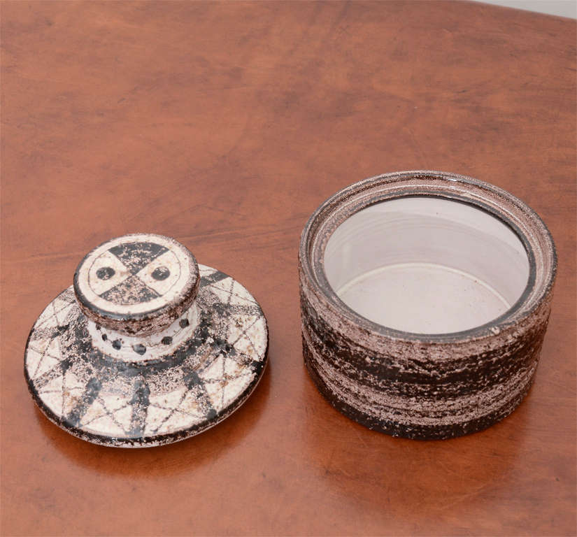 Textured Ceramic Jar with graphic design on lid. Marked on the base 