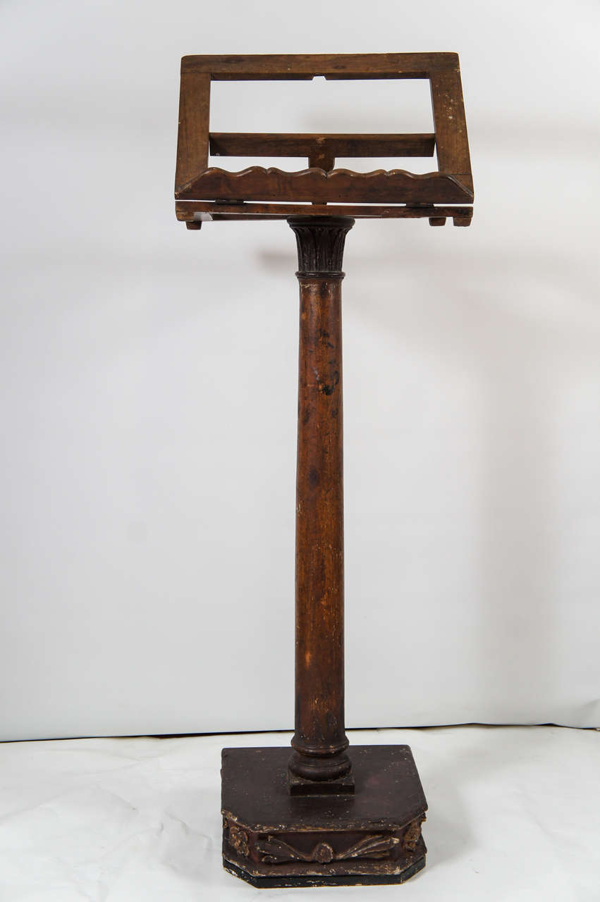 Antique oak music stand has five slots for adjusting the angle of the sheet music rack, which is supported by a classical column -- leaf capital, shaft, base included -- which sits on a 12