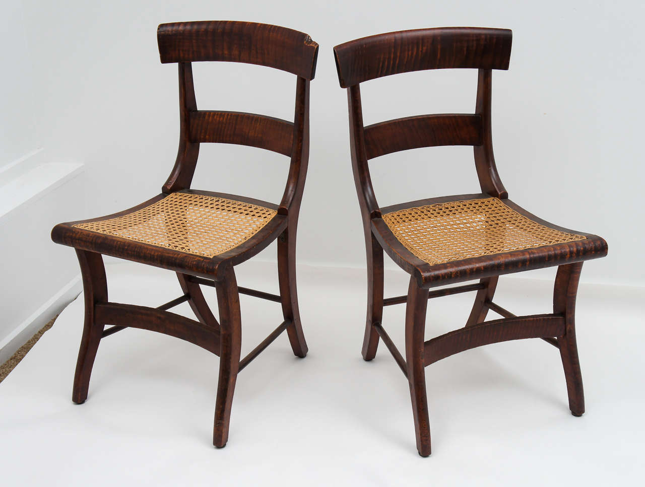 Set of six structurally sound tiger maple dining chairs, last quarter 19thC. As noted in the photos, we have intentionally left the imperfections intact, reflecting the years of enjoyment these chairs have provided.