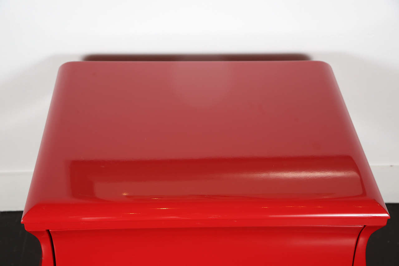 A pair of red lacquered mid-century nightstands.