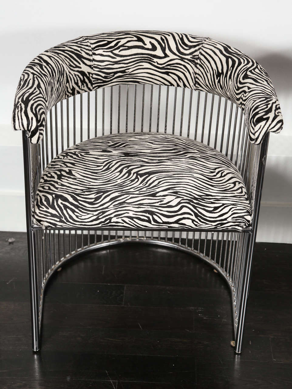 Modernist chair in zebra print cowhide with tubular rows of chrome plated steel.