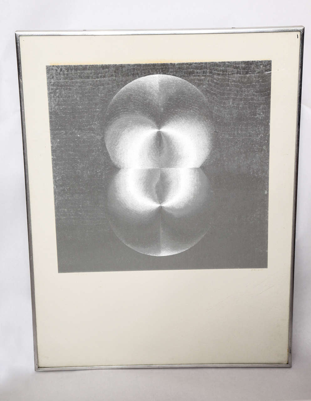 A 1970s abstract print on silver foil.