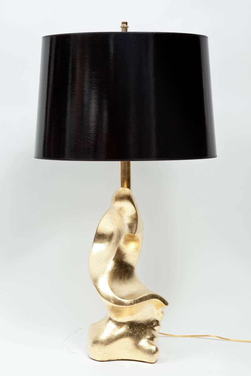Beautifully shaped art lamps, circa 1940. They are gold leafed.