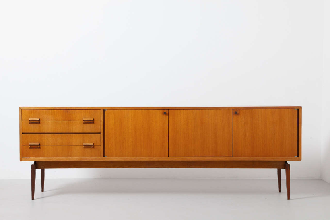 Sideboard ‘Paola’ by Oswald Vermaercke for V-Form in 1959. These editions were named at the Belgian Queen 'Paola' who married King Albert in 1959.Very elegant series of sideboards,typical Belgian teak,bent wood inside.High Quality of Belgium Art