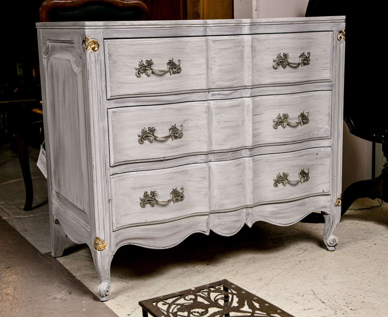 Pair of chests in Louis XV style, each white distress-painted, the conforming case fitted with three drawers each with brass pulls, raised on short cabriole legs ending in scrolled toes. Each having the Dixon powdermaker stamp. The Orleans