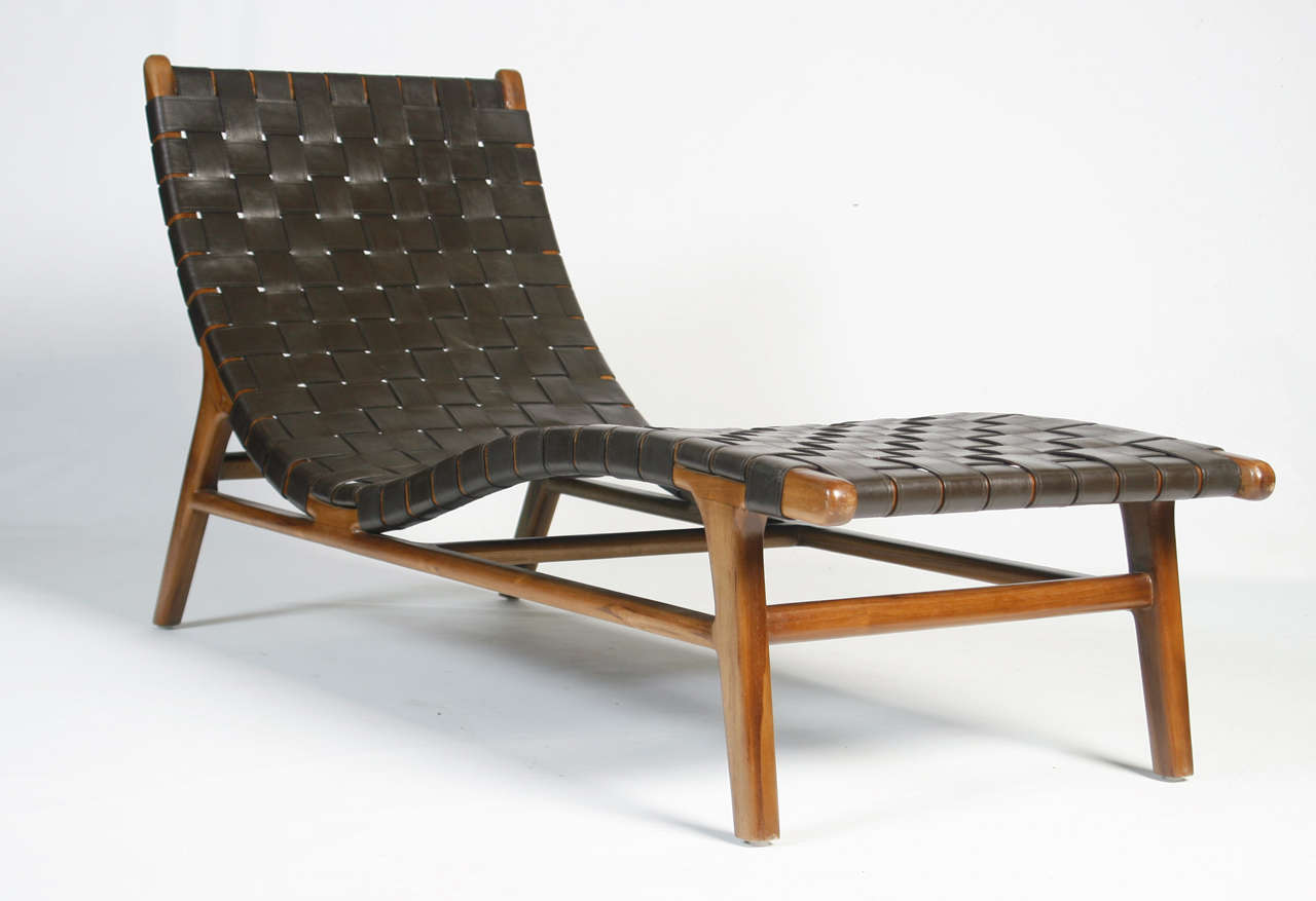 A very nice pair of 20th Century Danish lounge chairs. Leather stiched webbing.