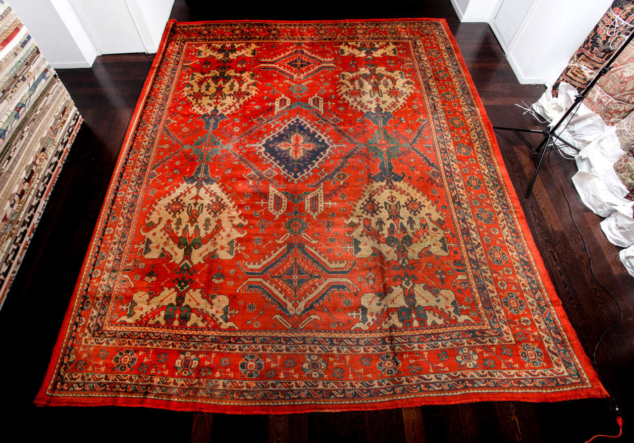 This Turkish Oushak carpet created circa 1880 consists of a handspun wool warp, weft and hand-knotted pile. It is an exceptional example of an Oushak made for internal use, which is why the colors are so rich and vibrant. The deep reds of the field