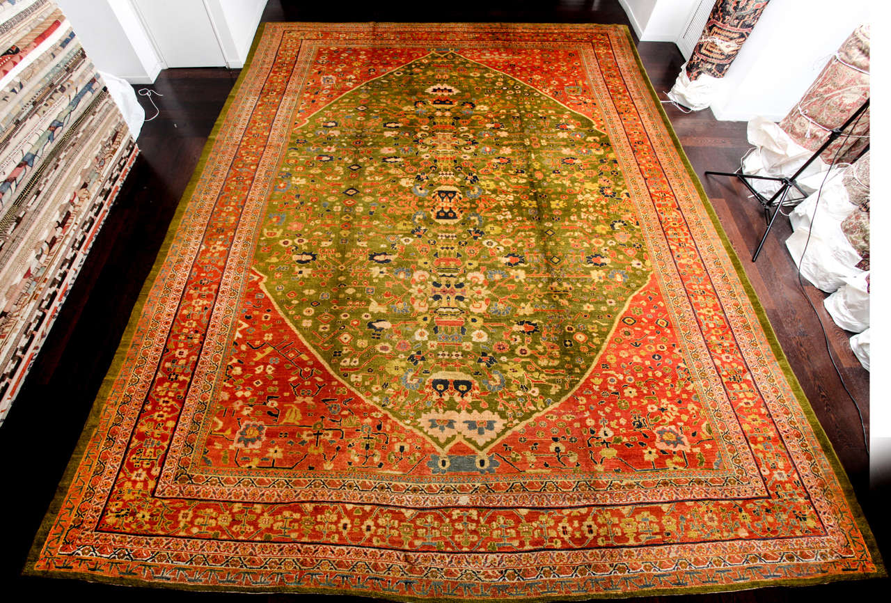 This Persian Sultanabad carpet circa 1880 was created using handspun wool and organic vegetable dyes. It is an exceptional Sultanabad by uniqueness of coloration and design, created by order of Prince Ghajar who governed over Arak at the time of its