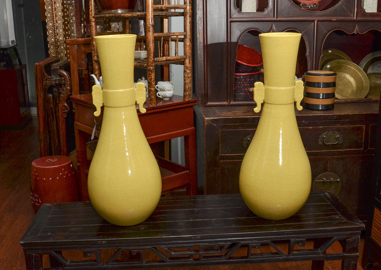 Contemporary Chinese imperial yellow palace jar with handles (two available, priced and sold separately).