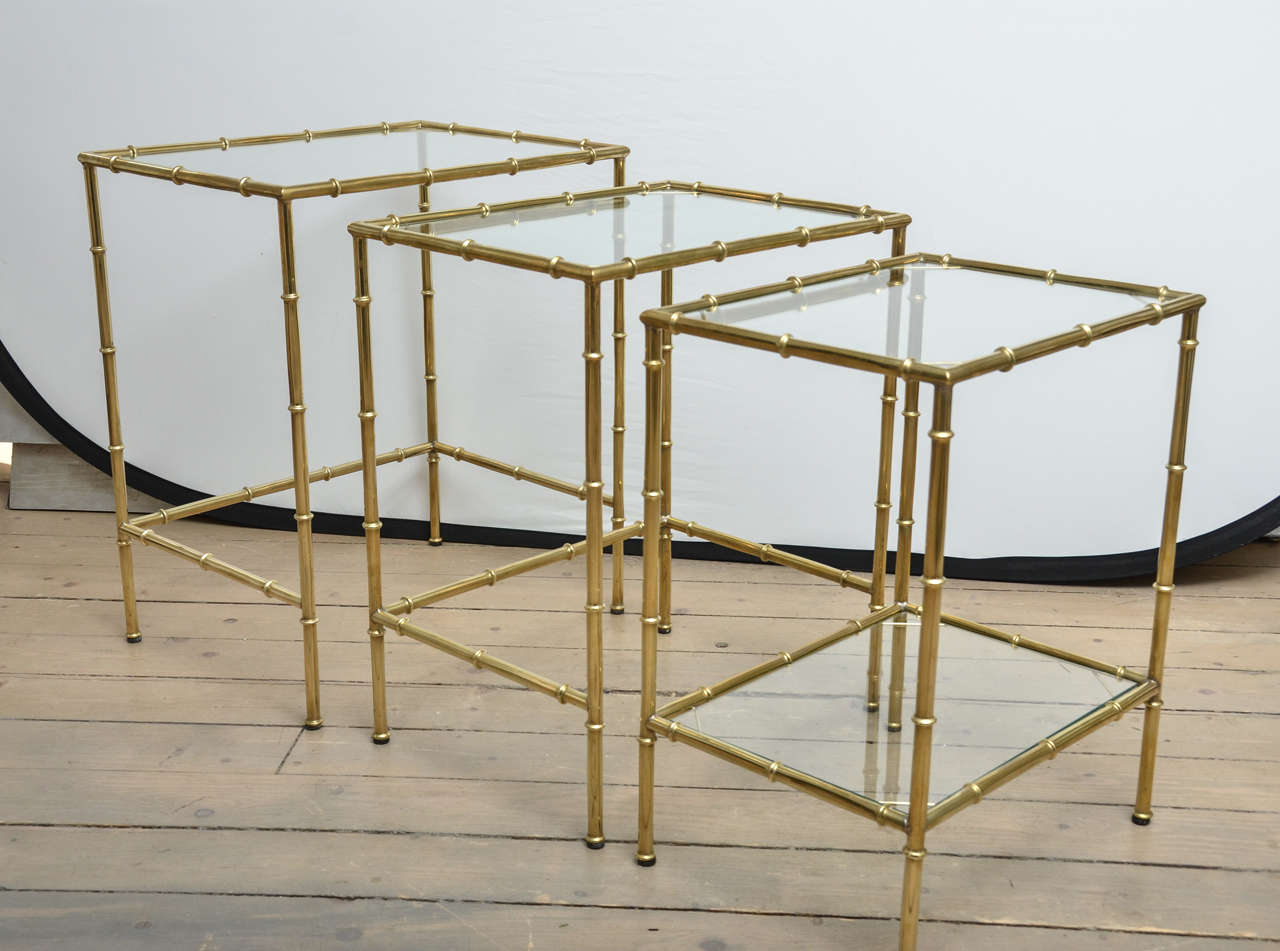 Set of three French brass faux bamboo and glass nesting tables.