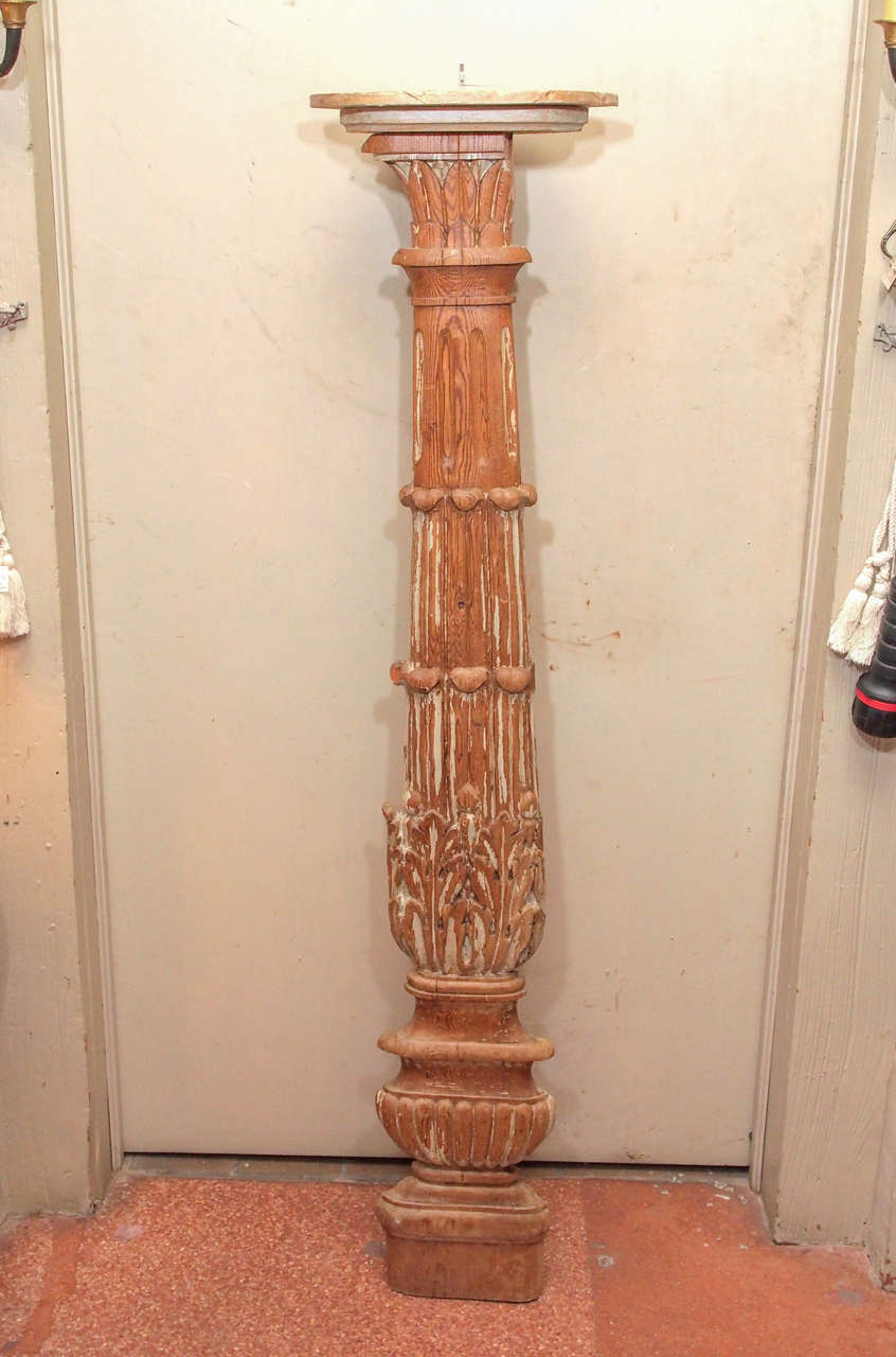 A French architectural carved oak wood pilaster. The pilaster is topped by a small corner shelf added at a much later date.  It is mostly stripped of it's original paint.