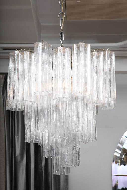 A striking and glamorous Venini four-tier chandelier with scalloped, textured crystals.