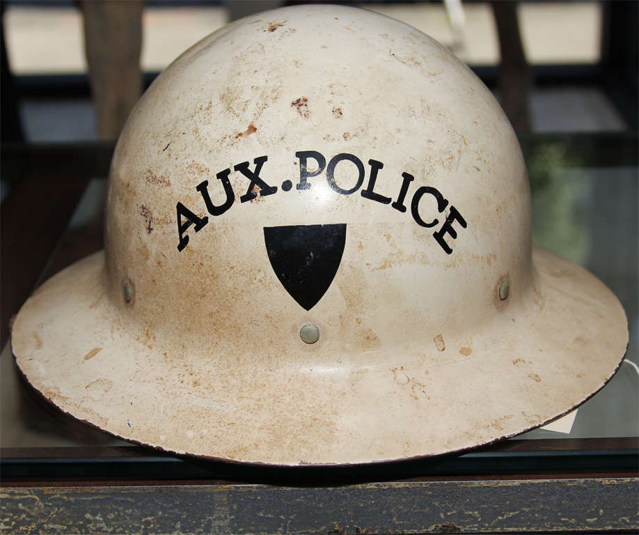 Intact helmet from Auxiliary Police Force   measurements are approximate- contact dealer for specifics