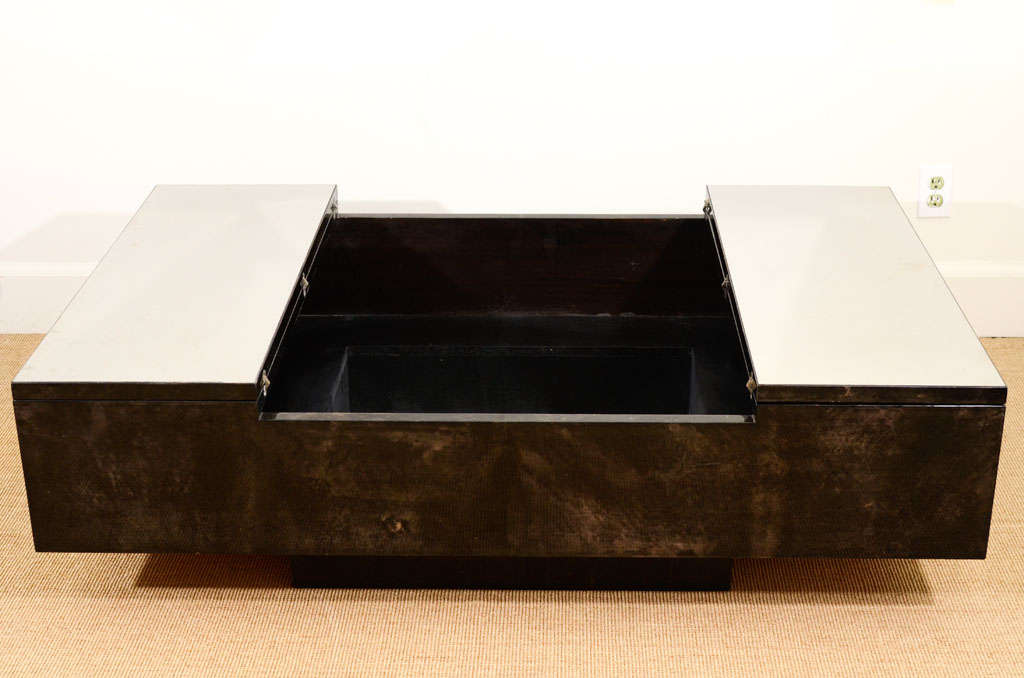An Aldo Tura Lacquered Parchment Opening Coffee Table.