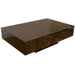 An Aldo Tura Lacquered Parchment Opening Coffee Table.