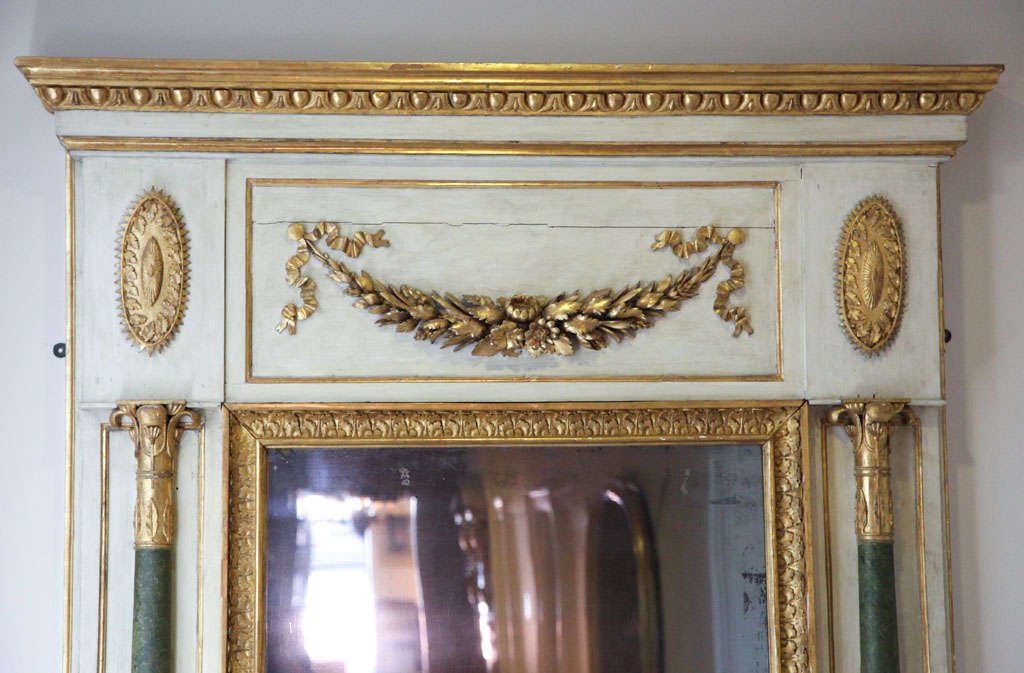 Ivory painted,faux marble and parcel gilt Baltic mirror