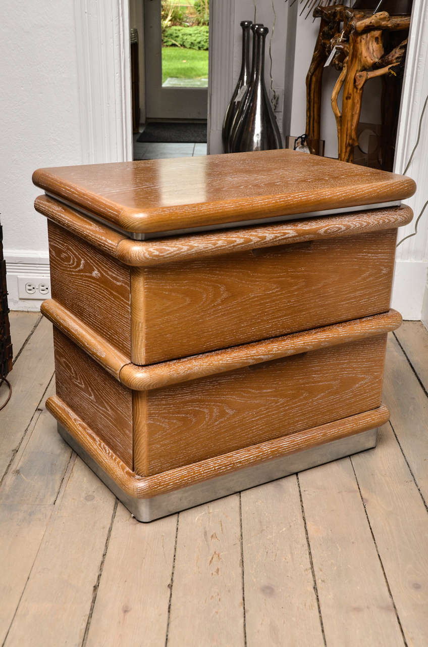 Pair of Ceruse Jay Spectre oak nightstands with 2 drawers and brushed chrome band details