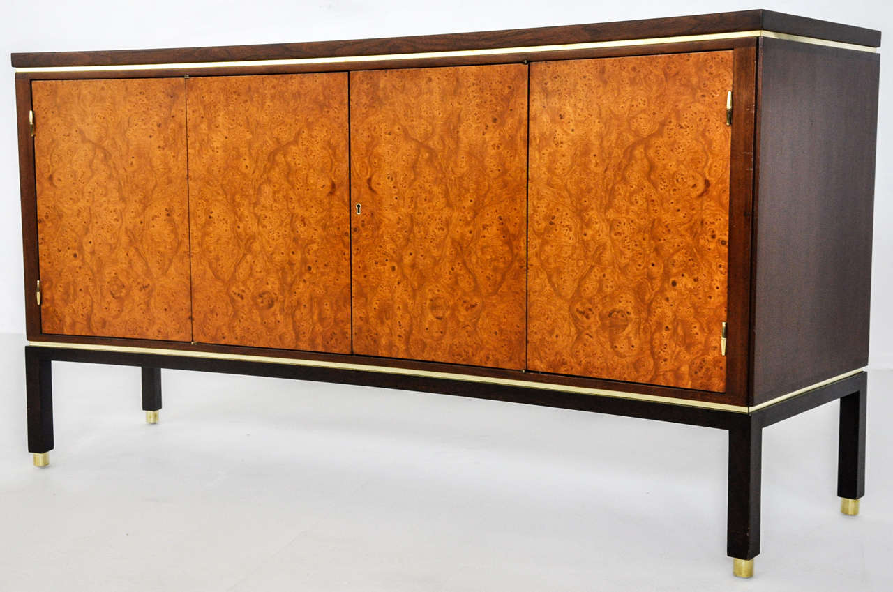 Curved front sideboard by Edward Wormley for Dunbar. Espresso finish case with burl wood doors and brass trim.
