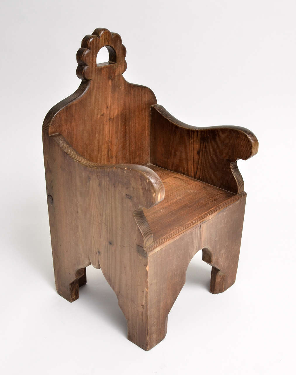 Masterful Pair of Arts & Crafts Armchairs Made for Children.
Sturdy waxed wood with stylized Romanesque Revival ornament:  arched openings-- a pierced cusp Back provides a convenient handle to move each chair.   Unique