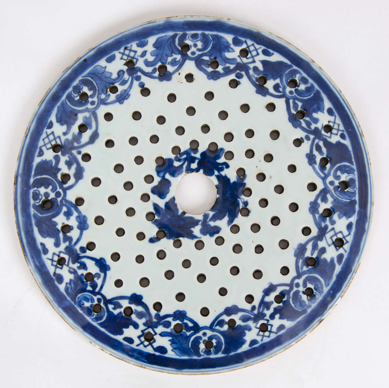 This is a good piece of Chinese blue and white porcelain, which we attribute to the late Ming dynasty but could be earlier.

The body is fairly granular and the glaze is thick with a bluish tinge, with the design in under-glaze blue.

The