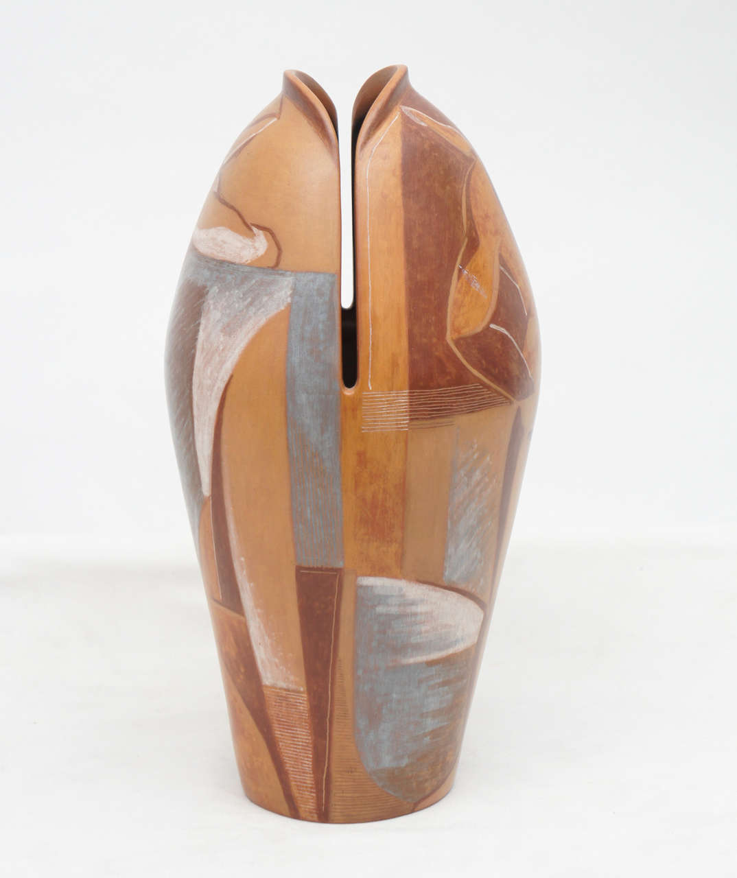 Stunning ceramic vase originally purchased from the Garth Clark Gallery. This unusual piece he the lips of a fish at the mouth, and paintings of men on the body. The abstract designs suggest cubist design, and the beiges, tans, grays and blue colors
